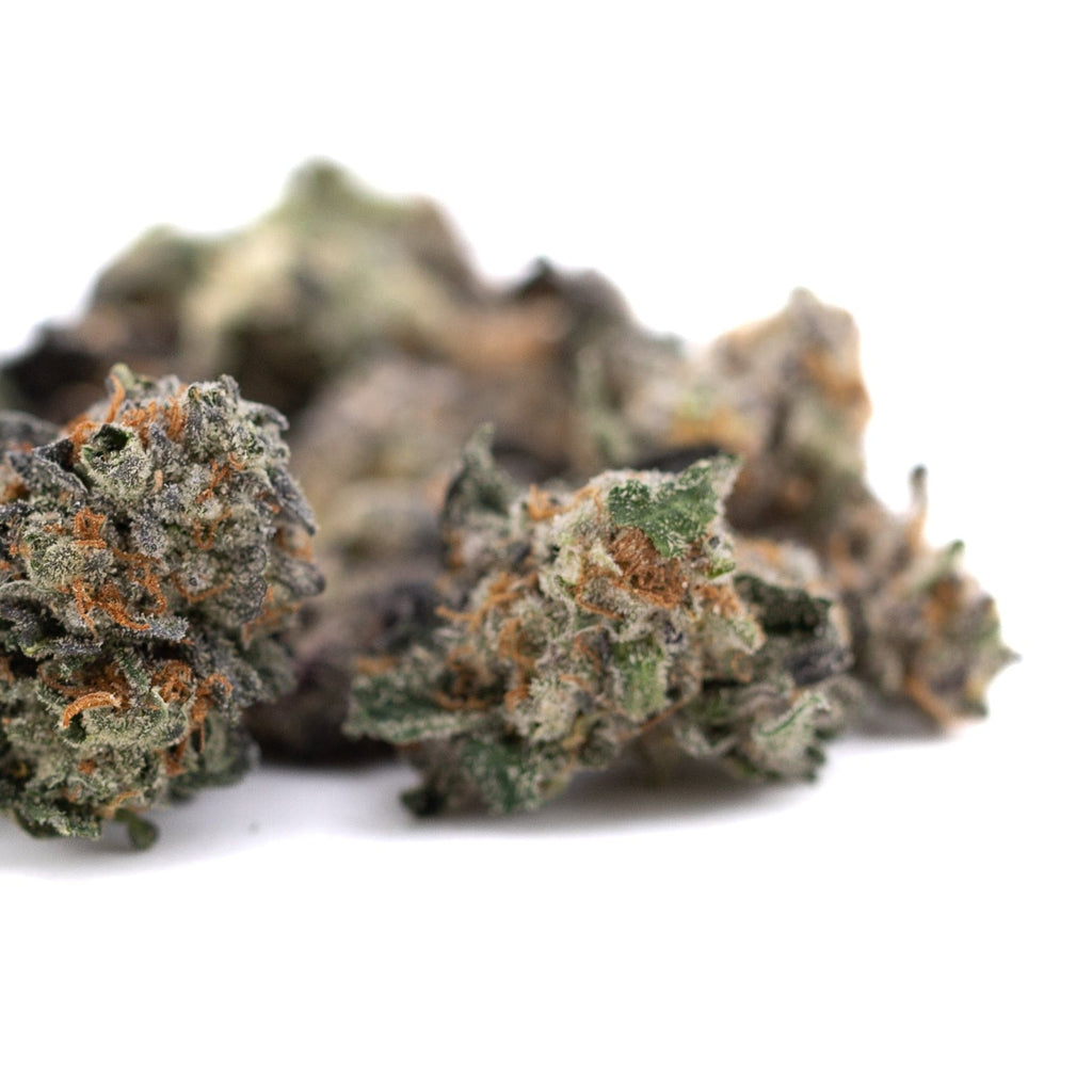 Chunky Monkey Indoor THCa Flower Smalls featuring a pile of premium cannabis buds