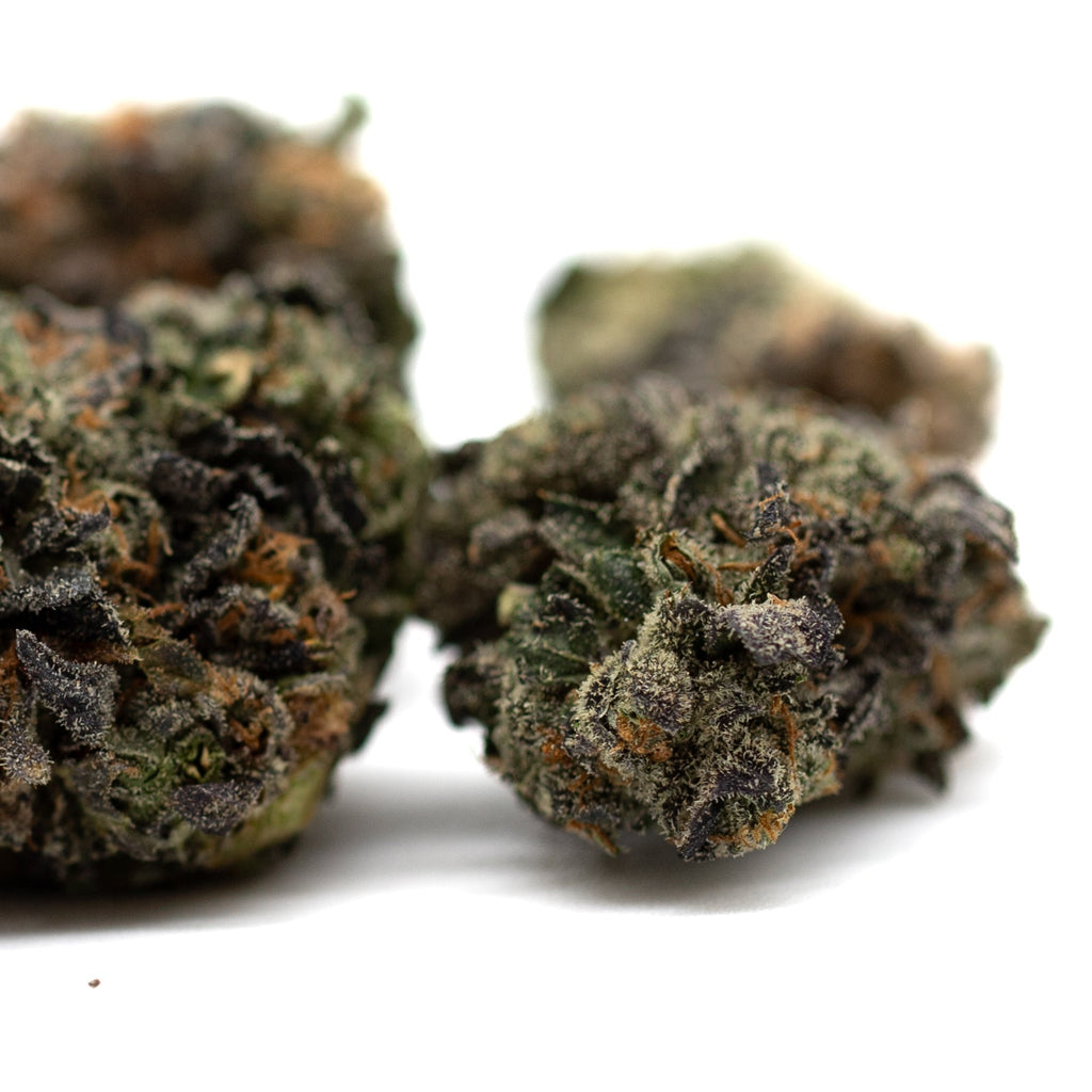 Lemon OG Indoor THCa Flower Wholesale featuring dense orchard swirl hemp flower with deep greens and purple hues
