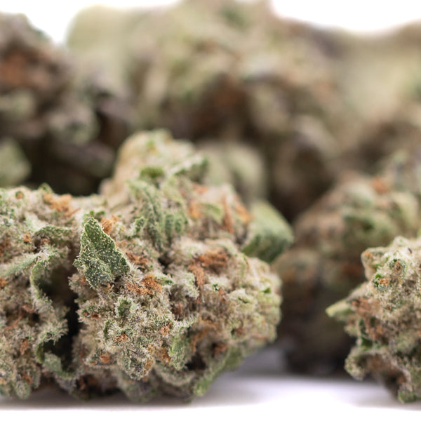 Premium Subzero THCa hemp flower smalls with green buds, white trichomes, orange pistils